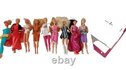 Barbie doll lot 9 Barbies in different out fits Mattel